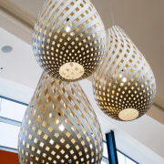 A view of the lighting in Sylvia Park. ceiling, chandelier, lamp, lampshade, light fixture, lighting, lighting accessory, gray, white
