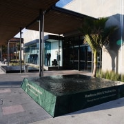 A view of a water feature by Mayfair architecture, reflection, window, black