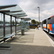 A view of the raoding by Flow Transportation bus stop, public space, transport, vehicle, white, gray