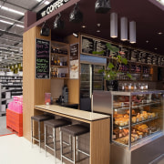 A view of a shop in Sylvia Park café, display case, interior design, retail, table, white, black