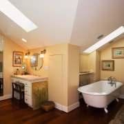 A view of the bathroom, wooden flooring, rugs, bathroom, ceiling, estate, floor, flooring, home, interior design, real estate, room, brown, gray, orange