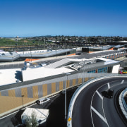 A view of some building materials from Dimond. building, car, city, metropolitan area, road, roof, sky, structure, transport, urban area, black