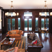 Interior view of the living area featuring  flooring, hardwood, home, interior design, living room, real estate, room, window, wood, wood flooring, black