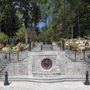 Exterior view of the landscaped gardens and pavings, outdoor structure, walkway, wall, gray, black