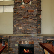 view of the stone fireplace constructed by alpine brick, fireplace, hearth, wall, wood, brown