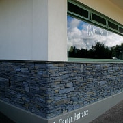 vie2w of this stone clad wall constructed by architecture, daylighting, glass, wall, window, gray, black