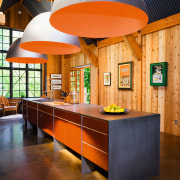 A view of this contemporary kitchen featuring polished architecture, ceiling, furniture, interior design, lobby, table, brown, orange