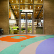 A view of the Papamoa library constructed by architecture, floor, flooring, interior design, leisure, leisure centre, real estate, brown