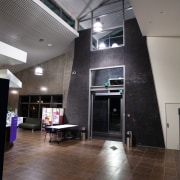 A view of some lighting in the Papamoa architecture, ceiling, daylighting, floor, flooring, glass, house, interior design, lobby, wood, gray, black