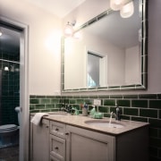 view of this bathroom featuring a double vainty bathroom, bathroom accessory, ceiling, home, interior design, room, sink, white, gray, black