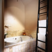 A view of a bathroom, tiled floor, white bathroom, floor, home, interior design, plumbing fixture, room, tile, wall, brown