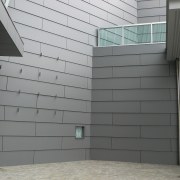 A view of the Vector Arena. - A architecture, building, daylighting, facade, glass, siding, structure, wall, window, gray, black