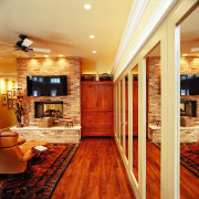 A view of the master bedroom. - A ceiling, floor, flooring, hardwood, home, interior design, laminate flooring, living room, lobby, real estate, room, wall, wood, wood flooring, orange, red