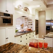 A view of the kitchen area, wooden cabinetry, cabinetry, ceiling, countertop, cuisine classique, floor, flooring, home, interior design, kitchen, room, white, brown