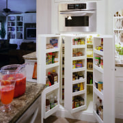 A close up view of the kitchen cabinetry. cabinetry, countertop, furniture, interior design, kitchen, pantry, refrigerator, shelf, shelving, gray