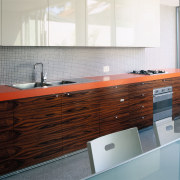 A view of some stainless steel kitchen appliances bathroom, bathroom accessory, bathroom cabinet, cabinetry, countertop, floor, flooring, hardwood, interior design, kitchen, sink, tile, wall, gray, white