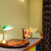 View of the upholstered bench seat with table bedroom, ceiling, furniture, home, interior design, lighting, lighting accessory, room, table, wall, wood, orange