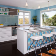 view of the kitchen featuring blum kitchen cabinetry, countertop, dining room, home, interior design, kitchen, real estate, room, gray, white