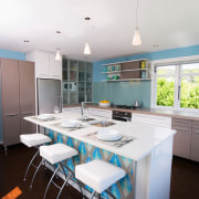 view of the kitchen featuring blum kitchen cabinetry, countertop, daylighting, interior design, kitchen, real estate, room, table, white