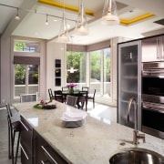 A view of this kitchen featuring dark brown countertop, cuisine classique, interior design, kitchen, gray