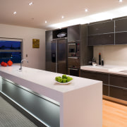 A view of the kitchen area, wooden flooring, cabinetry, countertop, interior design, kitchen, real estate, gray, black