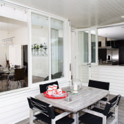A view of the exterior dining area. - interior design, kitchen, living room, real estate, white, gray