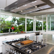 A close up view of the cooktop and countertop, interior design, kitchen, white, gray