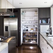 A view of the kitchen area, wooden flooring countertop, cuisine classique, home appliance, interior design, kitchen, white, black