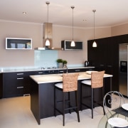 This kitchen features dark chocolate-coloured cabinetry and smeg cabinetry, countertop, cuisine classique, interior design, kitchen, property, real estate, room, gray, black