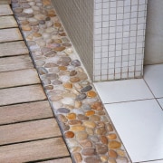A view of the wood slate boardwalk and floor, flooring, tile, wall, gray