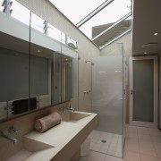 A view of the bathrom featuring tiled walls/flooring, architecture, bathroom, daylighting, floor, glass, house, interior design, real estate, window, gray, black