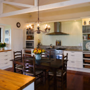 A view of some custom made kitchen cabinetry gray