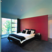 A view of the master bedroom, red feature architecture, bed, bed frame, bedroom, ceiling, floor, furniture, home, interior design, lighting, mattress, property, real estate, room, wall, window