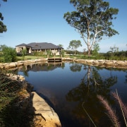 View of the steam and lake that is lake, landscape, plant, pond, real estate, reflection, reservoir, sky, tree, water, wetland, black