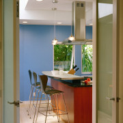 A view of this contemporary kitchn featuring gherry cabinetry, ceiling, countertop, floor, furniture, home, interior design, kitchen, room, window, brown, gray