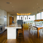 A view of the kitchen and dining area ceiling, countertop, floor, flooring, house, interior design, kitchen, real estate, room, wood flooring, brown