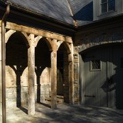 Exterior view of stone clad home with antique arch, architecture, building, facade, structure, window, black