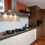 View of this kitchen Featuring miele rangehood and cabinetry, countertop, cuisine classique, floor, flooring, hardwood, interior design, kitchen, room, under cabinet lighting, wood flooring, gray, brown