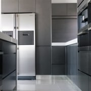 View of this modern kitchen designed by DK architecture, interior design, kitchen, product design, black, gray