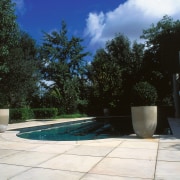 A view of some paving from Original Stone. architecture, backyard, estate, home, house, landscape, landscaping, outdoor structure, plant, property, real estate, residential area, swimming pool, tree, wall, yard, black, white