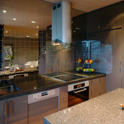 A vie wof some alloy kitchen tiles by countertop, interior design, kitchen, room, under cabinet lighting, black, brown