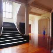 A view of the Peterborough Apartments,  architect architecture, ceiling, daylighting, estate, floor, flooring, hardwood, home, interior design, laminate flooring, lobby, property, real estate, stairs, structure, window, wood, wood flooring, brown