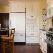 A view of the kitchen area, wooden flooring cabinetry, countertop, cuisine classique, door, floor, flooring, furniture, hardwood, home, interior design, kitchen, laminate flooring, room, window, wood, wood flooring, wood stain, brown, gray