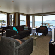 view of the living area featuring lounge suite, interior design, living room, real estate, room, black, gray