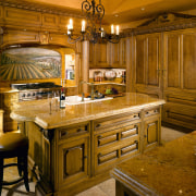 A view of this elegant kitchen featuring gold cabinetry, countertop, cuisine classique, home, interior design, kitchen, room, brown