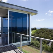 View of the living areas in this matapouri cottage, home, house, property, real estate, sky, window, teal