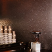 A view of this interior wall featuring a ceiling, interior design, still life photography, wall, wallpaper, black