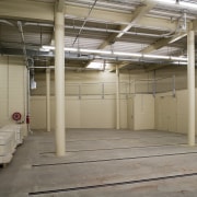 View of the new basement storage area in floor, flooring, structure, warehouse, gray, brown