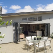 A view of a home by GJ Gadiner estate, home, house, outdoor structure, patio, property, real estate, villa, white