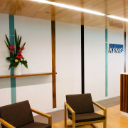 A view of soft ambient lighting supplied by architecture, ceiling, chair, floor, flooring, furniture, house, interior design, table, wood, brown, white